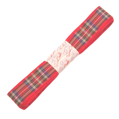 Red tartan ribbon with a white label on a white background