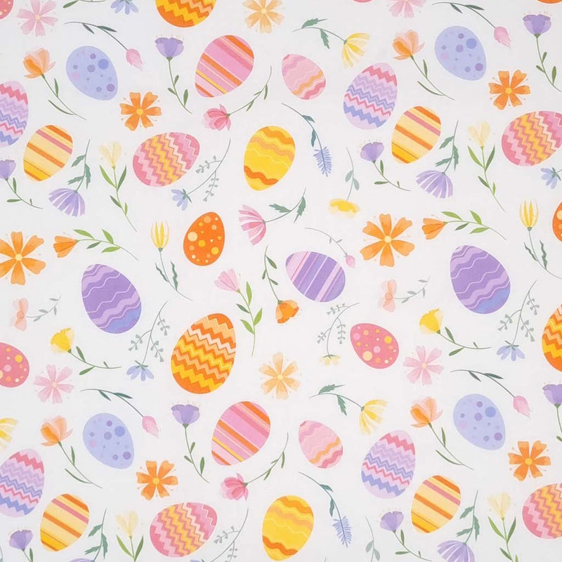 Easter eggs and flowers are printed on a white cotton fabric