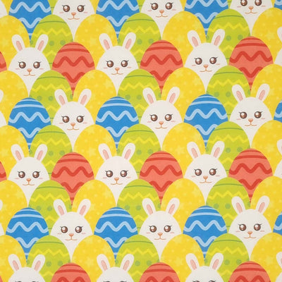 Bunnies hiding amongst easter eggs is printed on a cotton fabric by Rose & Hubble