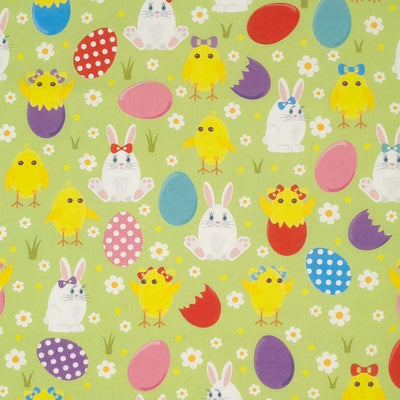 Easter bunnies, chicks and eggs are printed on a pastel green cotton fabric by Rose & Hubble