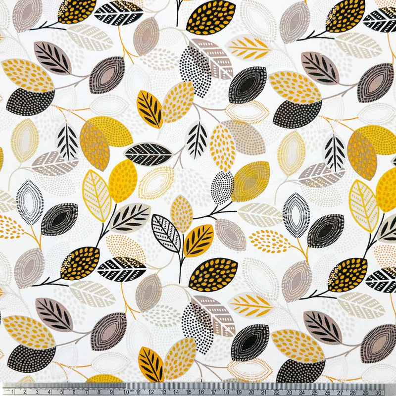 Detailed floral print of leaves in neutral shades of grey, black and yellow; printed on a white 100% cotton fabric with a cm ruler