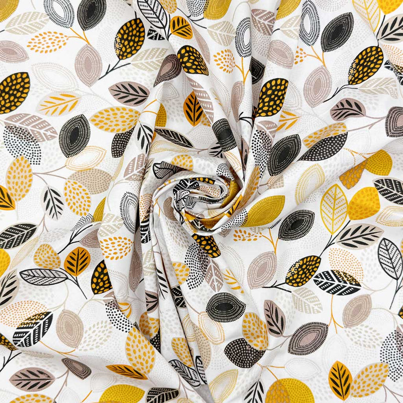 Detailed floral print of leaves in neutral shades of grey, black and yellow; printed on a white 100% cotton fabric
