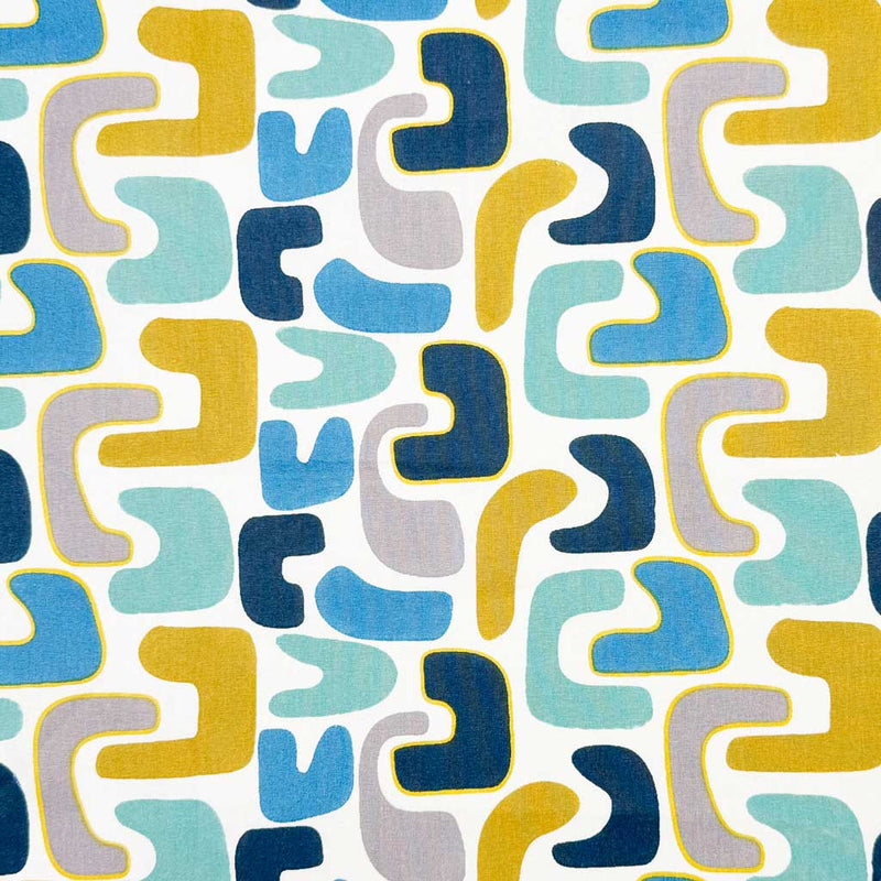 Abstract shapes of blue and yellow on a contrasting, bold white background printed on an 100% cotton fabric