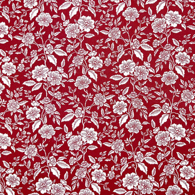 White flowers on a deep wine background; printed on a 100% cotton fabric