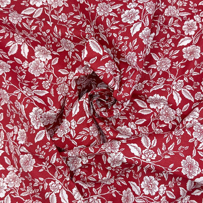 White flowers on a deep wine background; printed on a 100% cotton fabric