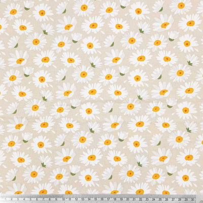A simple design of falling daisies, printed on a beige 100% cotton fabric with a cm ruler