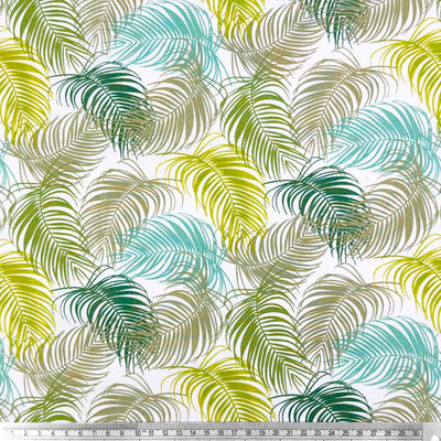 A floral design of intricate fan leaves in complimentary shades of green and blue with a cm ruler
