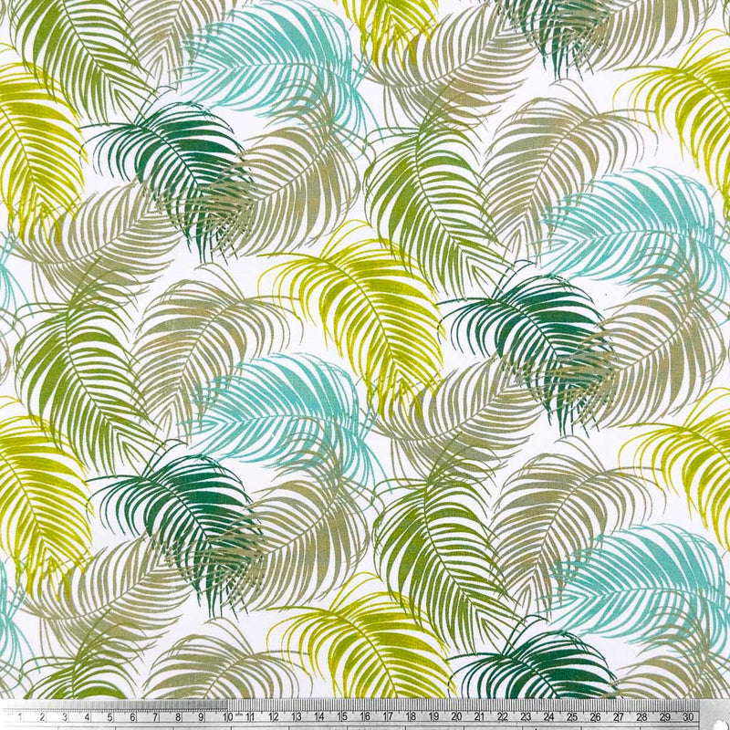 A floral design of intricate fan leaves in complimentary shades of green and blue with a cm ruler