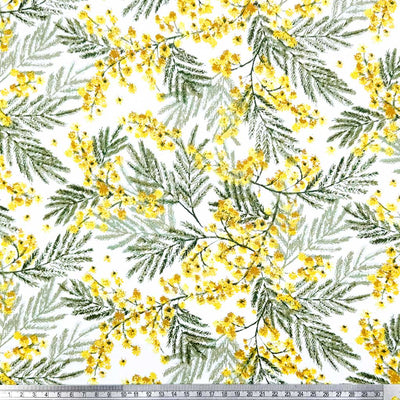 A detailed design of yellow wildflowers and delicate leaves; printed on a 100% cotton fabric with a cm ruler