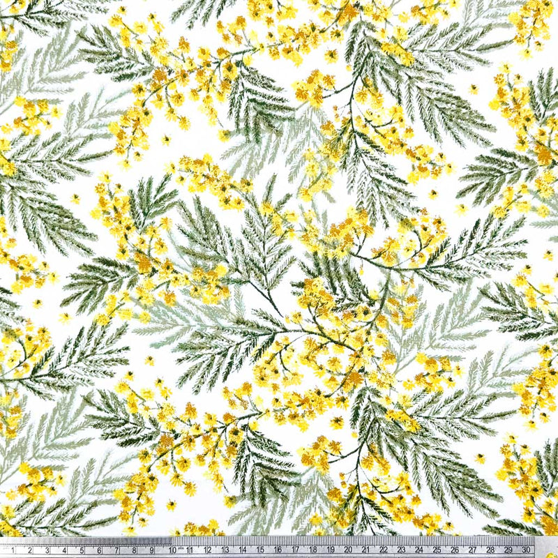 A detailed design of yellow wildflowers and delicate leaves; printed on a 100% cotton fabric with a cm ruler
