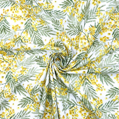 A detailed design of yellow wildflowers and delicate leaves; printed on a 100% cotton fabric
