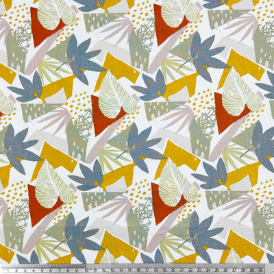 A bright, abstract design of leaves in bold red, blue and yellow on a contrasting background of greys; printed on a 100% cotton fabric with a cm ruler
