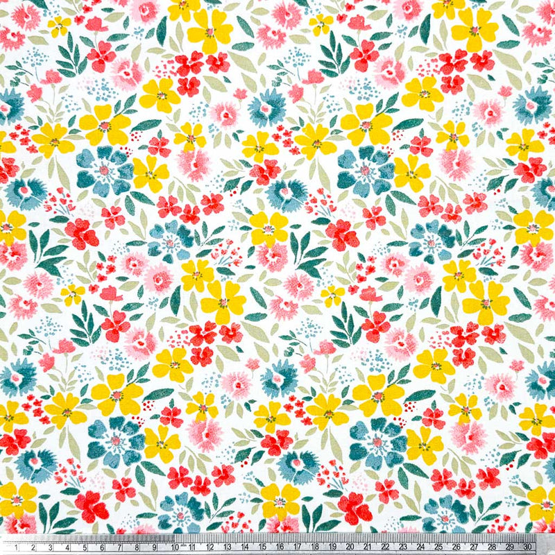 A beautiful and colourful display of wild flowers in yellow, blue and pink printed on a 100% cotton fabric with a cm ruler