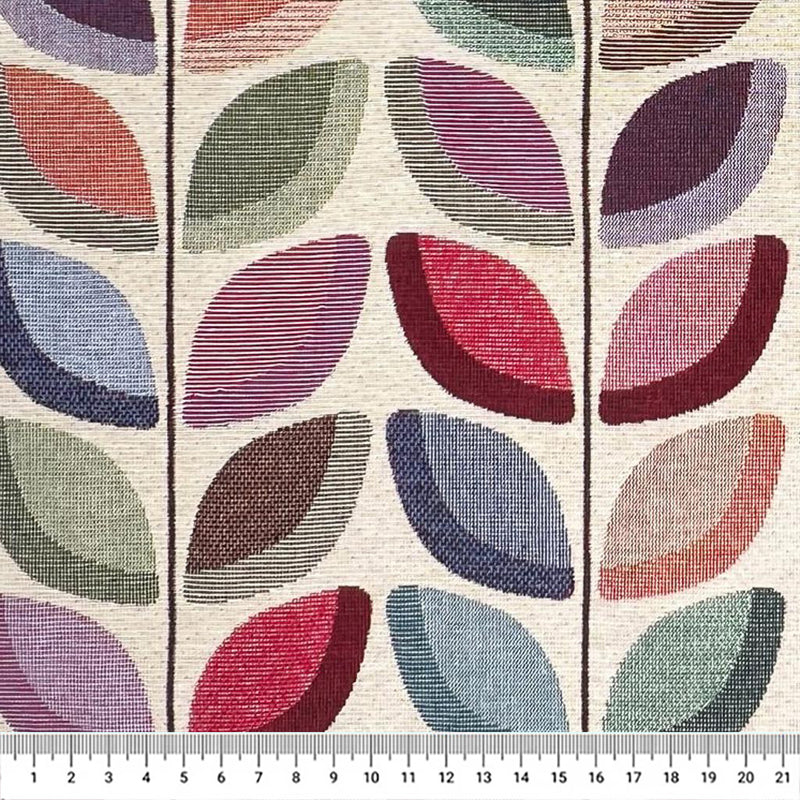 Colourful leaves on a vine printed on an upholstery tapestry fabric with a cm ruler