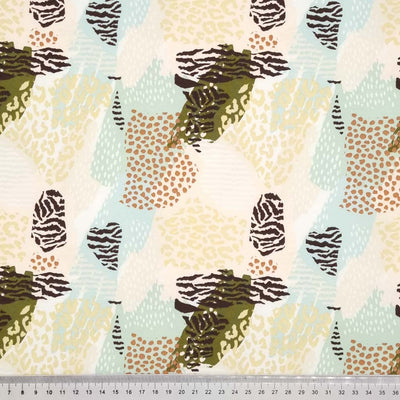 A summer animal print design printed on a cotton french terry fabric with a cm ruler