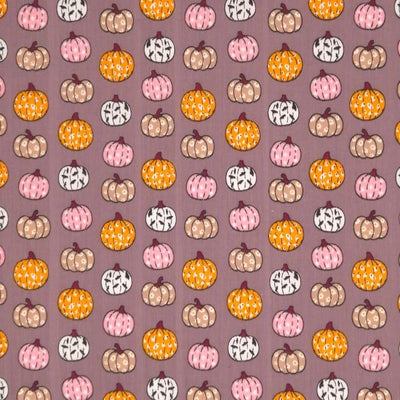 Ditsy decorated pumpkins printed on a grey polycotton fabric