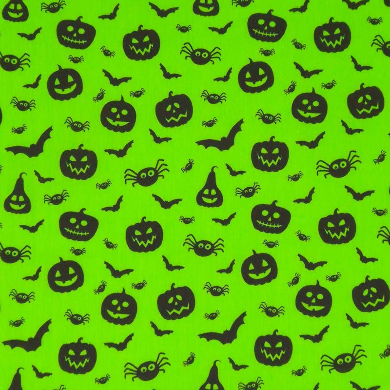 Halloween creatures printed on a neon green polycotton fabric