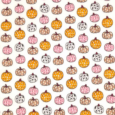 Ditsy pumpkins printed on a white polycotton fabric