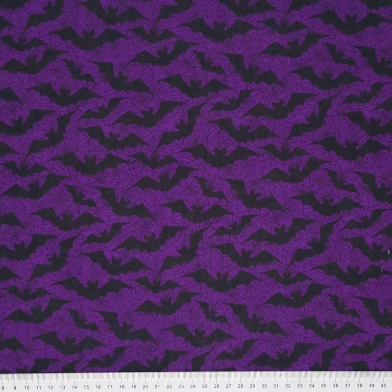 Black bats printed on a purple polycotton fabric