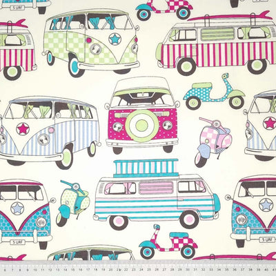 Brightly coloured campervans and scooters printed on a cream cotton fabric with a cm ruler