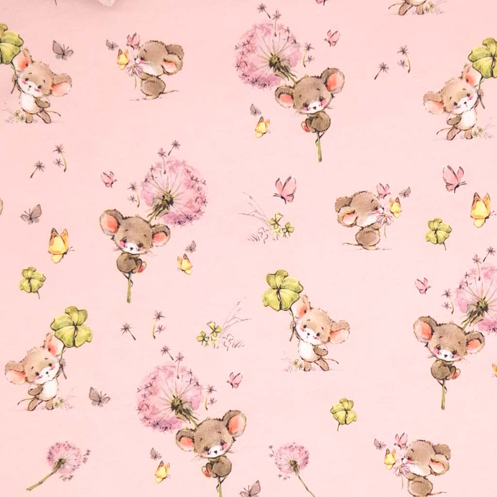 Cute mice holding clover printed on a pink cotton jersey fabric
