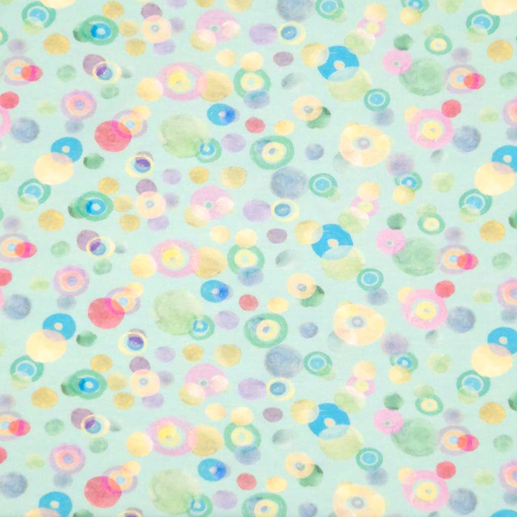 Pastel coloured spots printed on an aqua cotton jersey fabric flat perspective