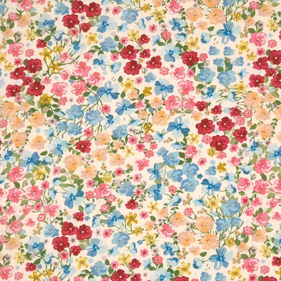 This fabric features hand-drawn effect flowers printed in beautiful shades of pink, peach and blue.