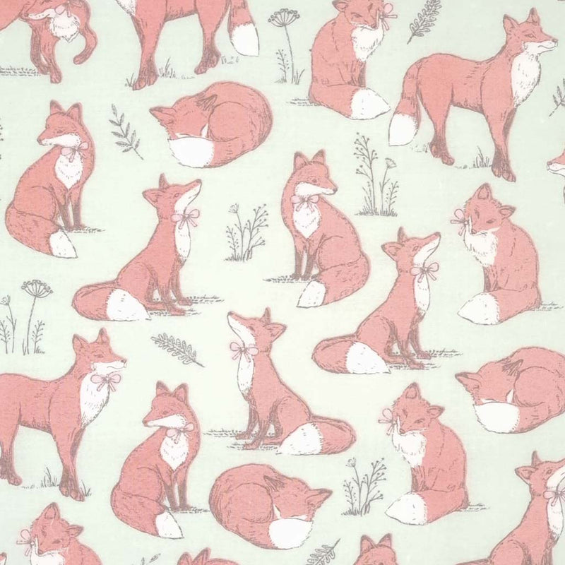 Brown foxes printed on a duck egg cotton fabric