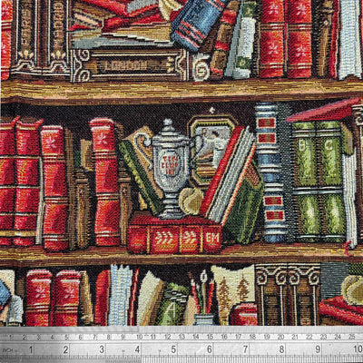 A library of books is printed on a tapestry fabric with a cm ruler