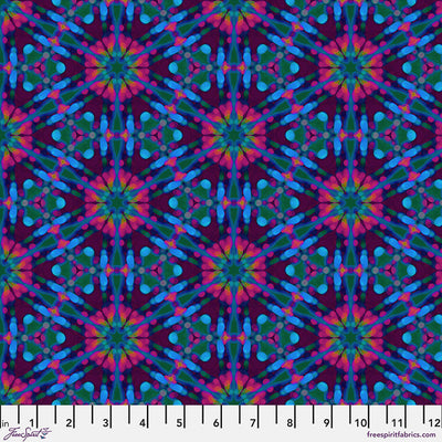 Colourful geometric pattern fabric with measurement scale at the bottom