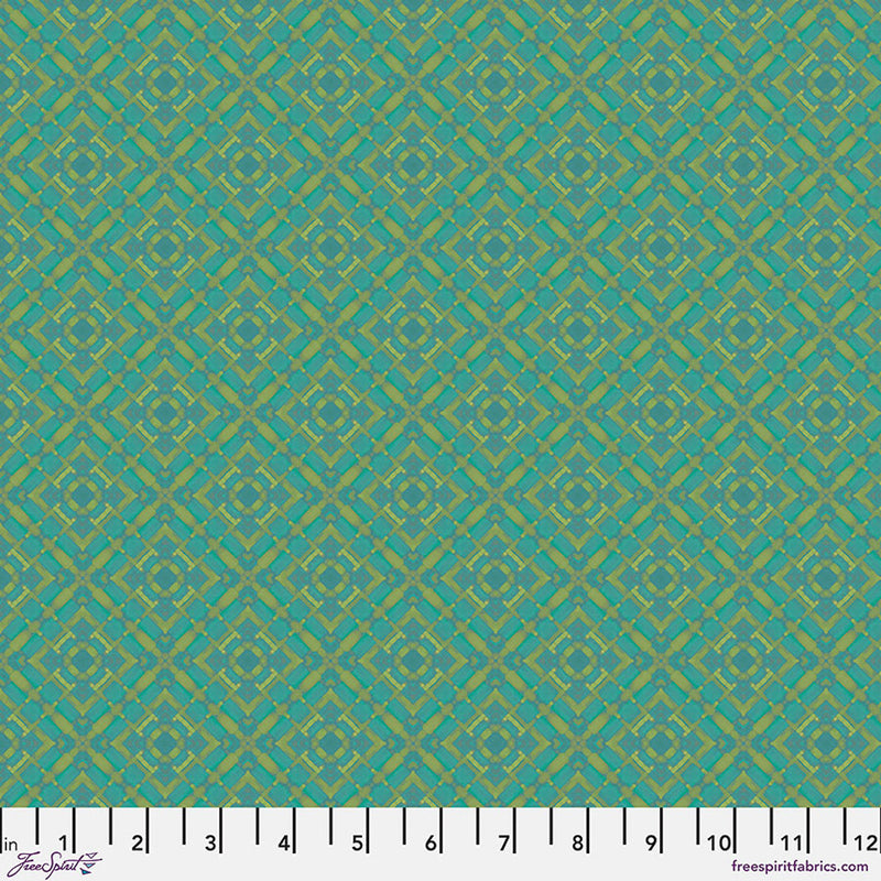 Teal fabric with a geometric pattern and a ruler at the bottom.