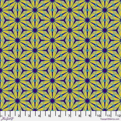 Geometric pattern with yellow and purple shapes on a cotton quilting fabric