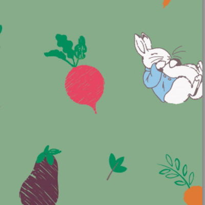 Peter Rabbit sleeping next to a radish printed on a cotton fabric