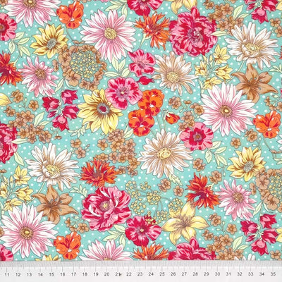 Pink and cerise flowers printed on a green cotton poplin fabric by Rose & Hubble with a cm ruler