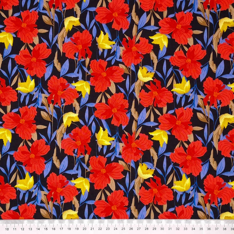 Floral fabric print by Rose & Hubble with red and gold flowers on a black cotton poplin with a cm ruler