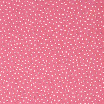Tiny stars and spots printed on a pink cotton poplin fabric by Rose & Hubble