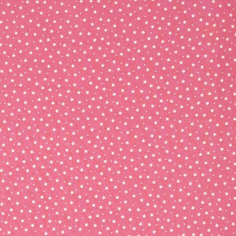 Tiny stars and spots printed on a pink cotton poplin fabric by Rose & Hubble