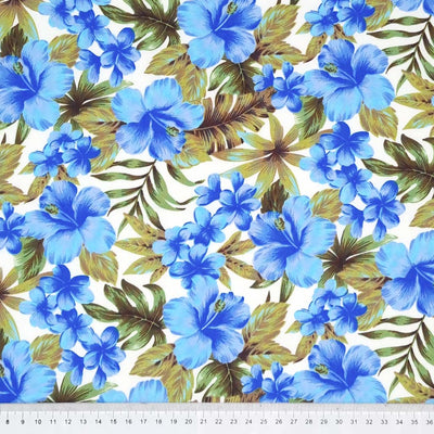 Tropical blue flowers printed on an ivory cotton poplin fabric with a cm ruler