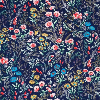 A garden of beautiful flowers printed on a navy cotton poplin fabric