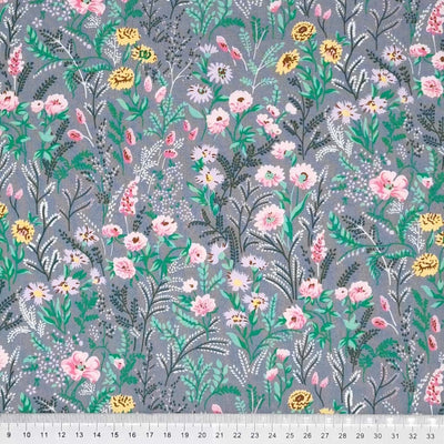 A garden of beautiful flowers printed on a silvery grey cotton poplin fabric with a cm ruler