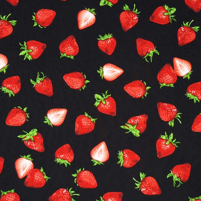 Red strawberries printed on a black cotton poplin fabric