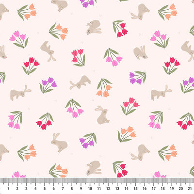 Tulip bunches in pinks and purples scattered around grey bunnies on a cream 100% cotton fabric with a cm ruler