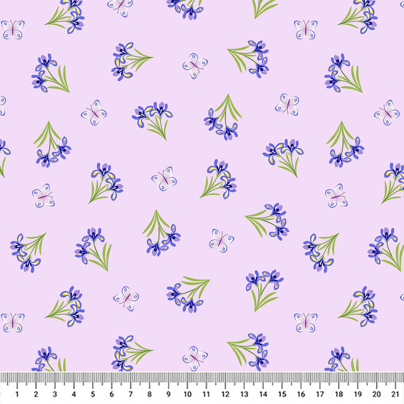 Blue and white butterflies fluttering around delicate blue irises on an 100% cotton fabric with a cm ruler