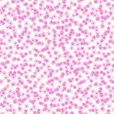 Pretty pink shaded blossoms scattered across a white 100% cotton fabric