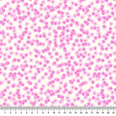 Pretty pink shaded blossoms scattered across a white 100% cotton fabric with a cm ruler