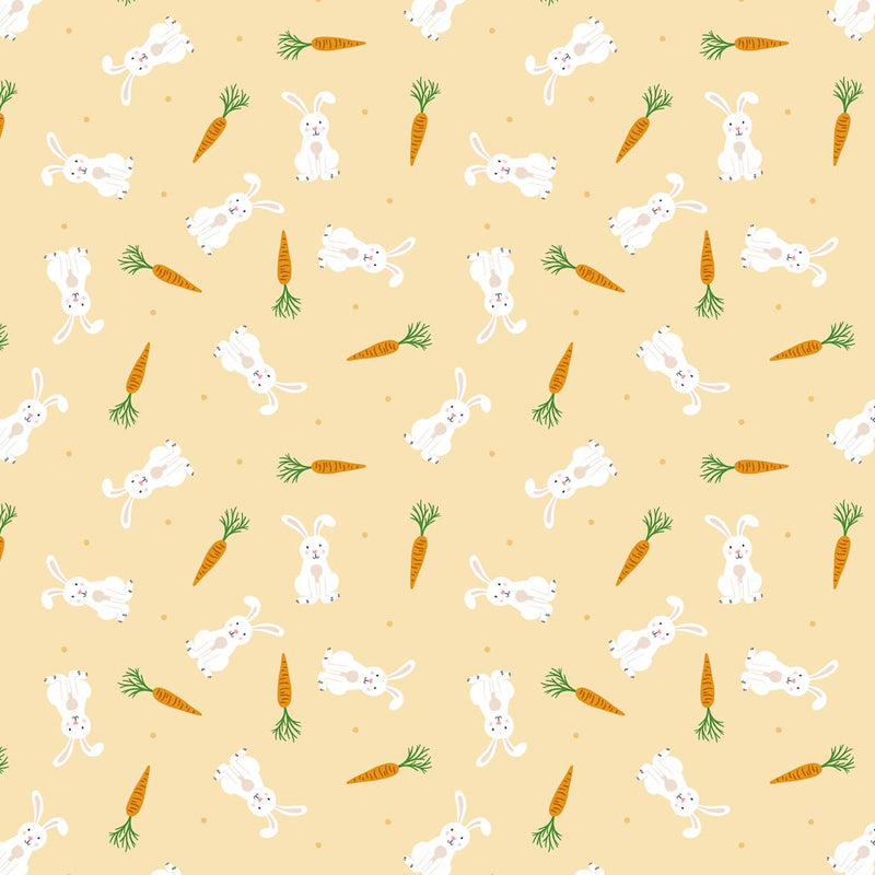 Springtime bunnies and carrots scattered among a pastel orange 100% cotton fabric