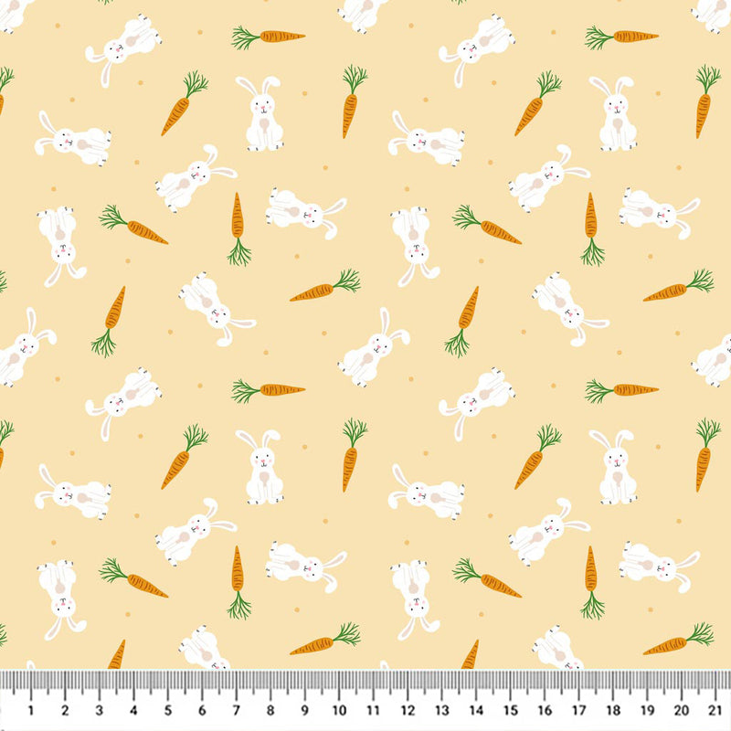 Springtime bunnies and carrots scattered among a pastel orange 100% cotton fabric with a cm ruler