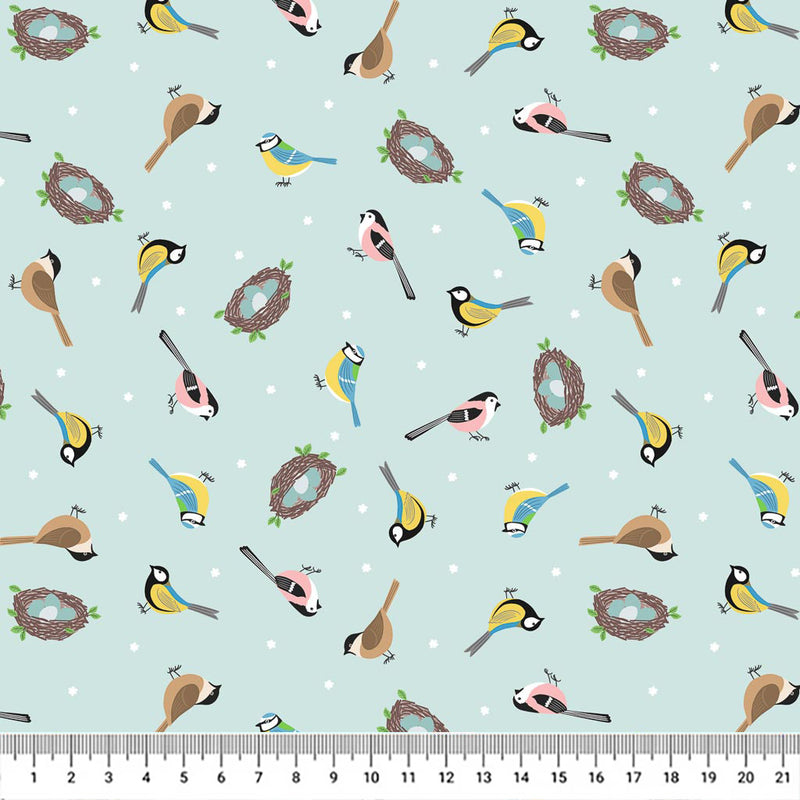 Birds and egg-filled nests on a sky blue 100% cotton fabric with a cm ruler