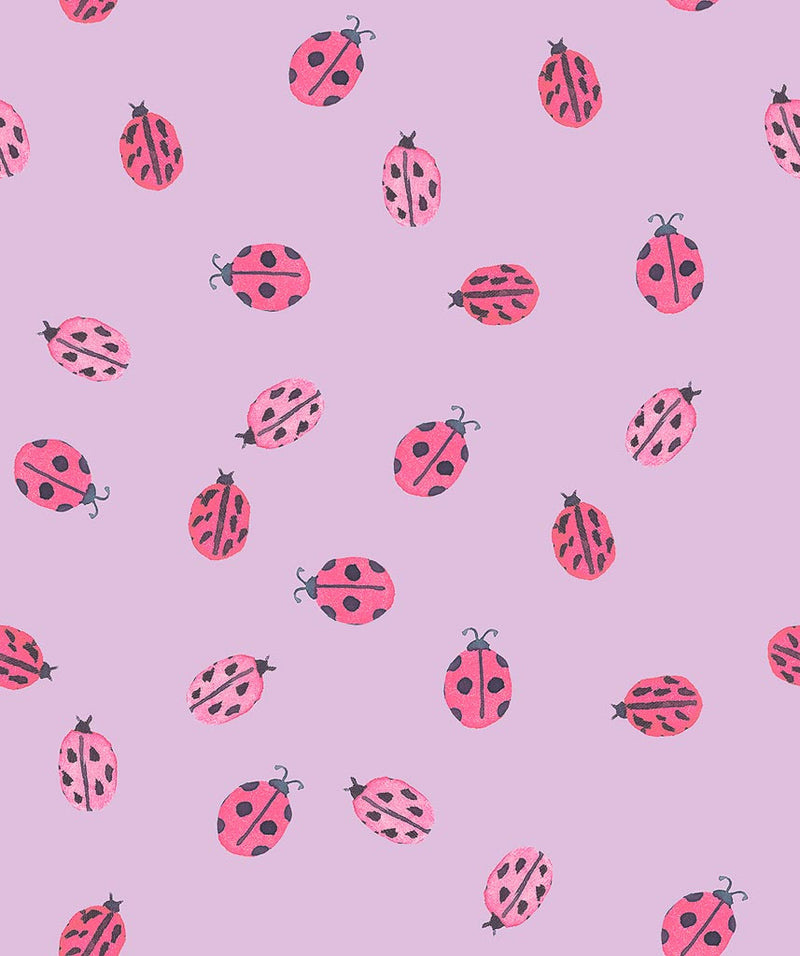 Ladybirds printed on a lilac cotton quilting fabric by Lewis & Irene