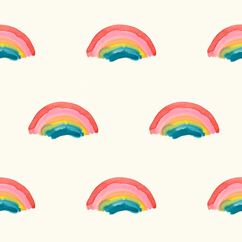 Rainbows printed on a cream quilting fabric by Lewis & Irene